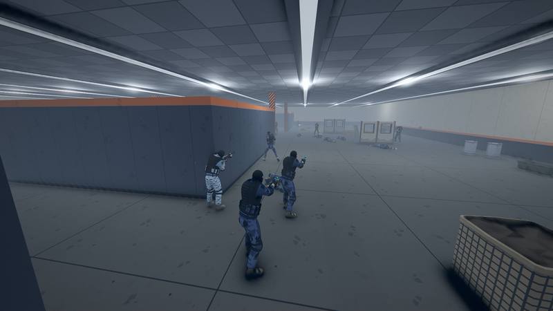 A team in blue camo pushes along a wall in the arena hall
